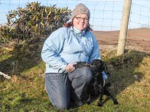 Poppy the dog with her owners